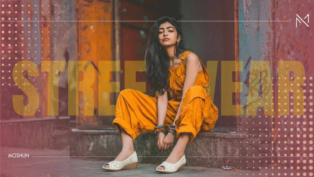 Woman in an orange outfit sitting on a step with 'Streetwear' text in the background